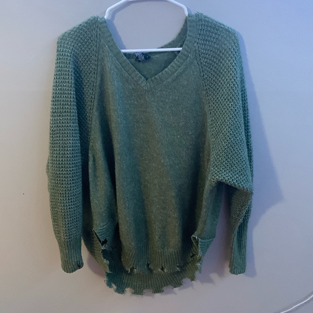 This is a green sweater from rue21 size large